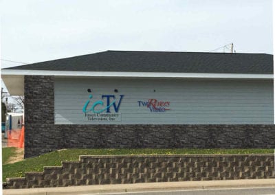 Signs on buildlng for Itasca Community Television, Inc and Two Rivers Video